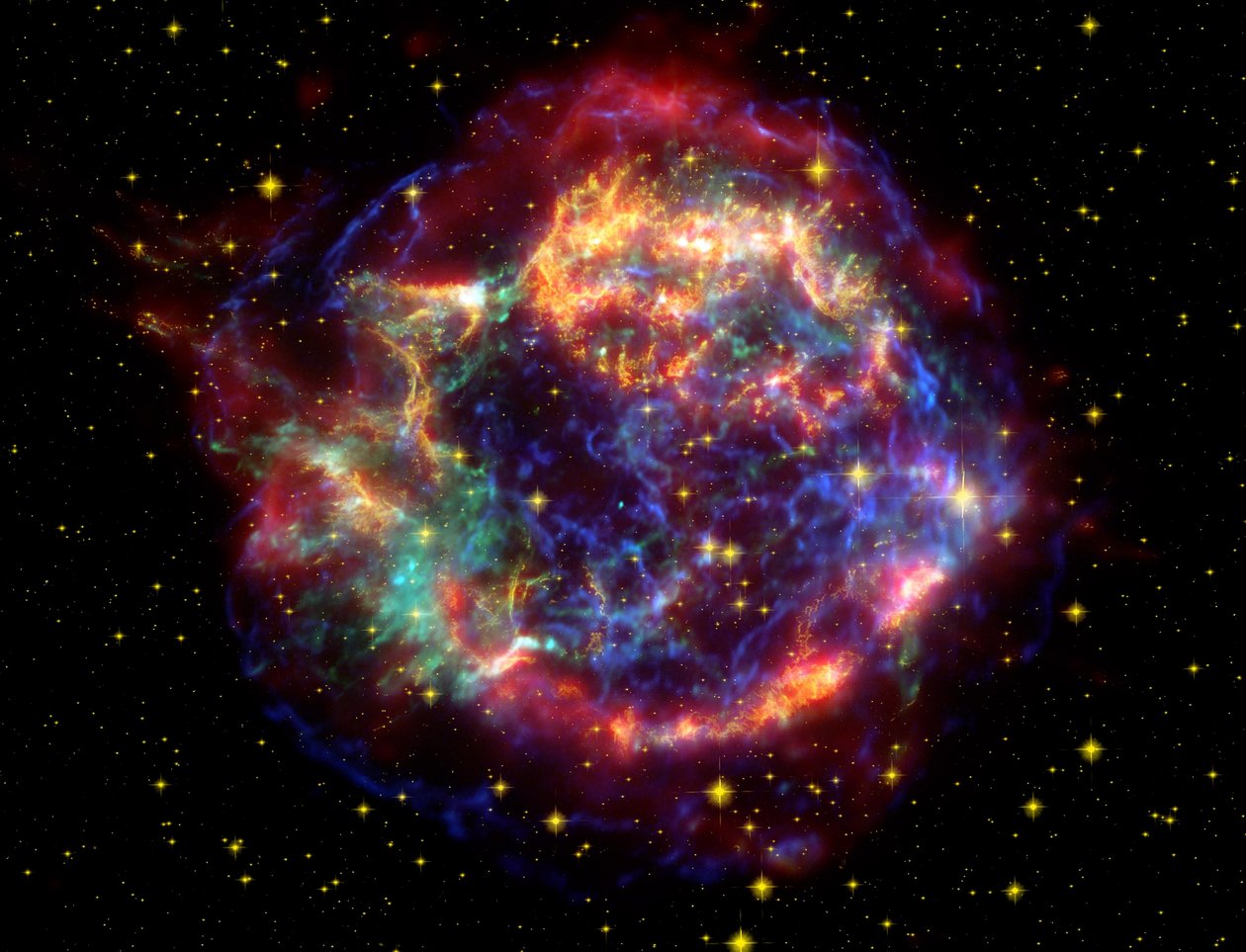 Bilde i falske farger av supernova-resten Cassiopeia A i stjernebildet Cassiopeia, 10 000 lysår unna. Det er resten av en en gang så massiv stjerne som døde i en supernovaeksplosjon. Kreditt NASA. Sci av National Aeronautics and Space Administration National Aeronautics and Space Administration