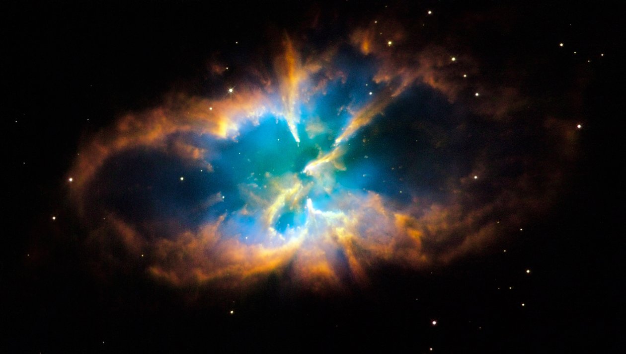Planetarisk tåke NGC 2818 i den sørlige konstellasjonen Pyxis (Kompasset). Glødende lag og skall av gass ble skapt når en stjerne kastet sine ytre lag ut i verdensrommet etter å ha gått tom for kjernekraft av National Aeronautics and Space Administration National Aeronautics and Space Administration