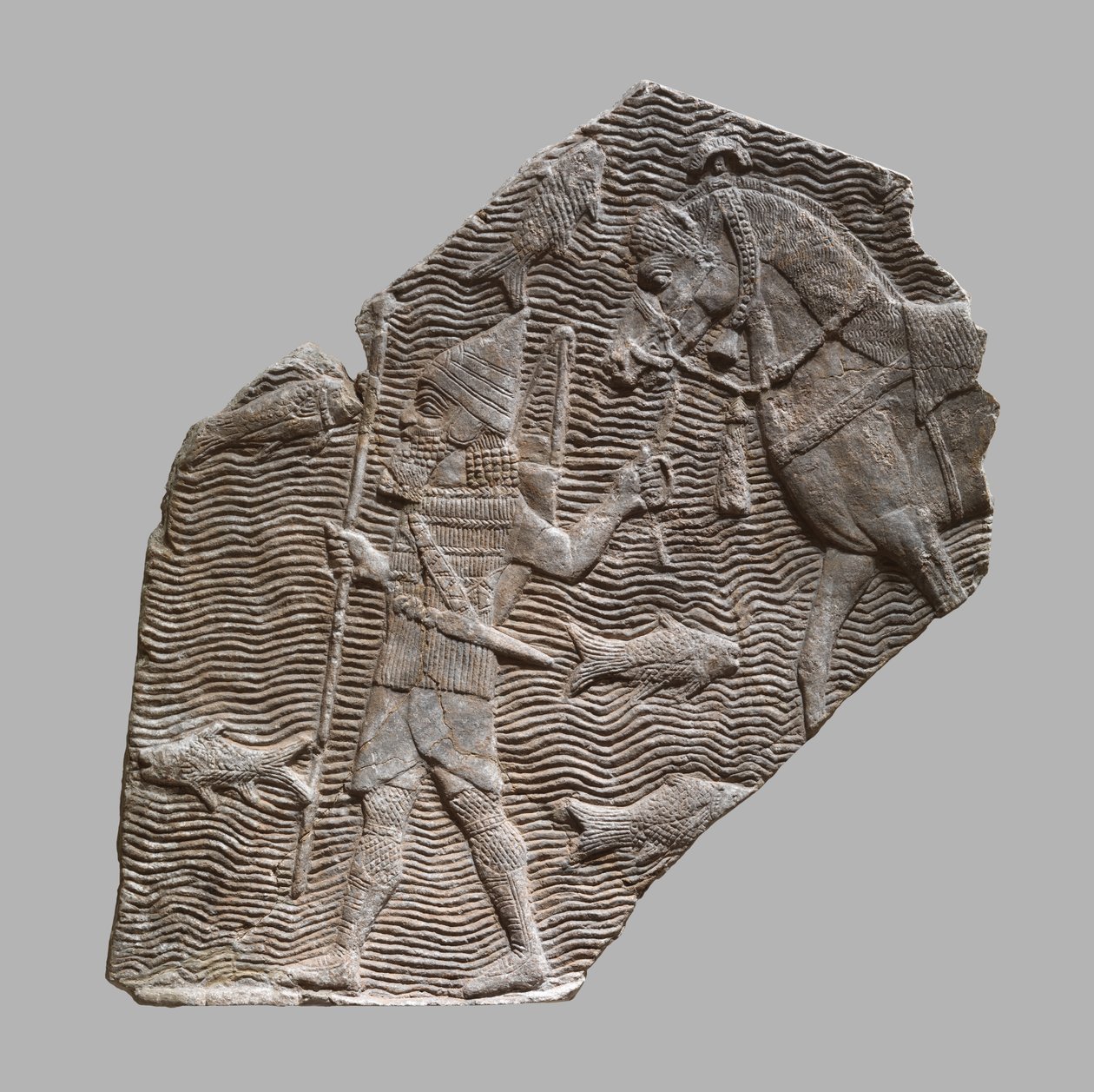 Reliefffragment: kavalerist som leder hesten sin ved siden av en bekk, ca. 704–681 f.Kr. (gipsalabast) av Neo Assyrian