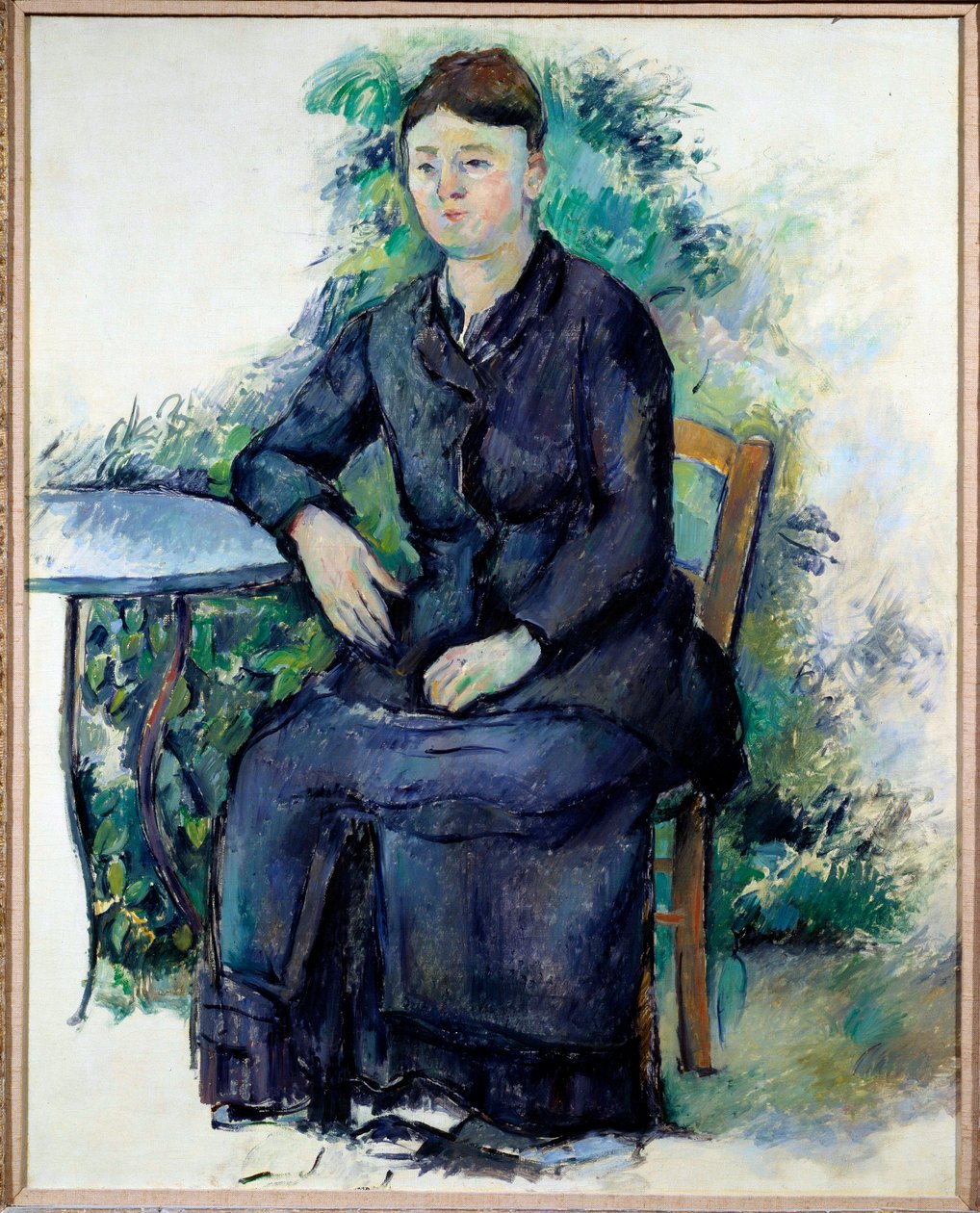 Portrett av Madame Cezanne i et hagemaleri av Paul Cezanne (1839-1906) 1800-tallets søn. 0,63x0,8 m Paris, Musee de l