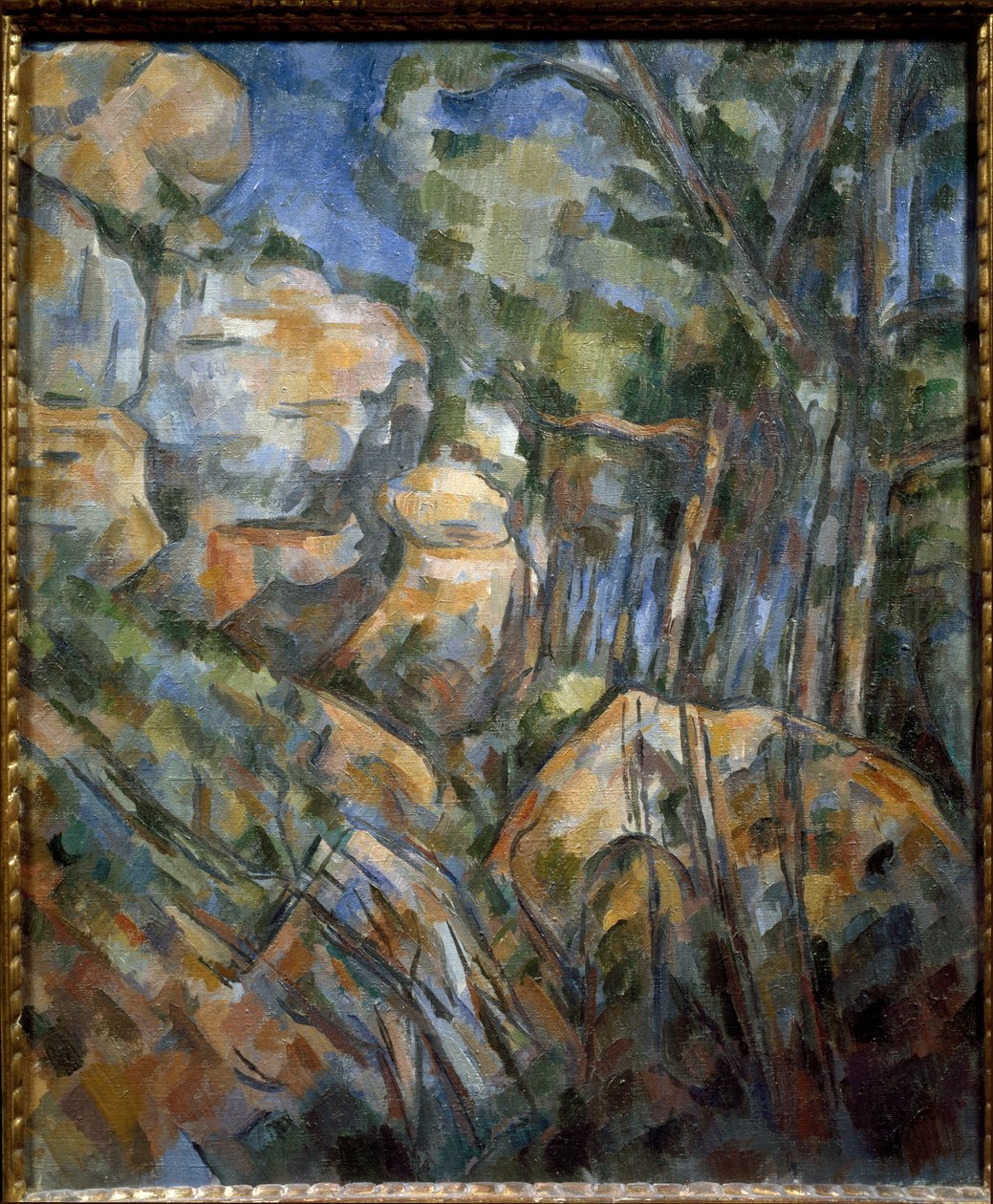 Steiner nær hulene over Chateau Noir (olje på lerret, ca. 1904) av Paul Cézanne