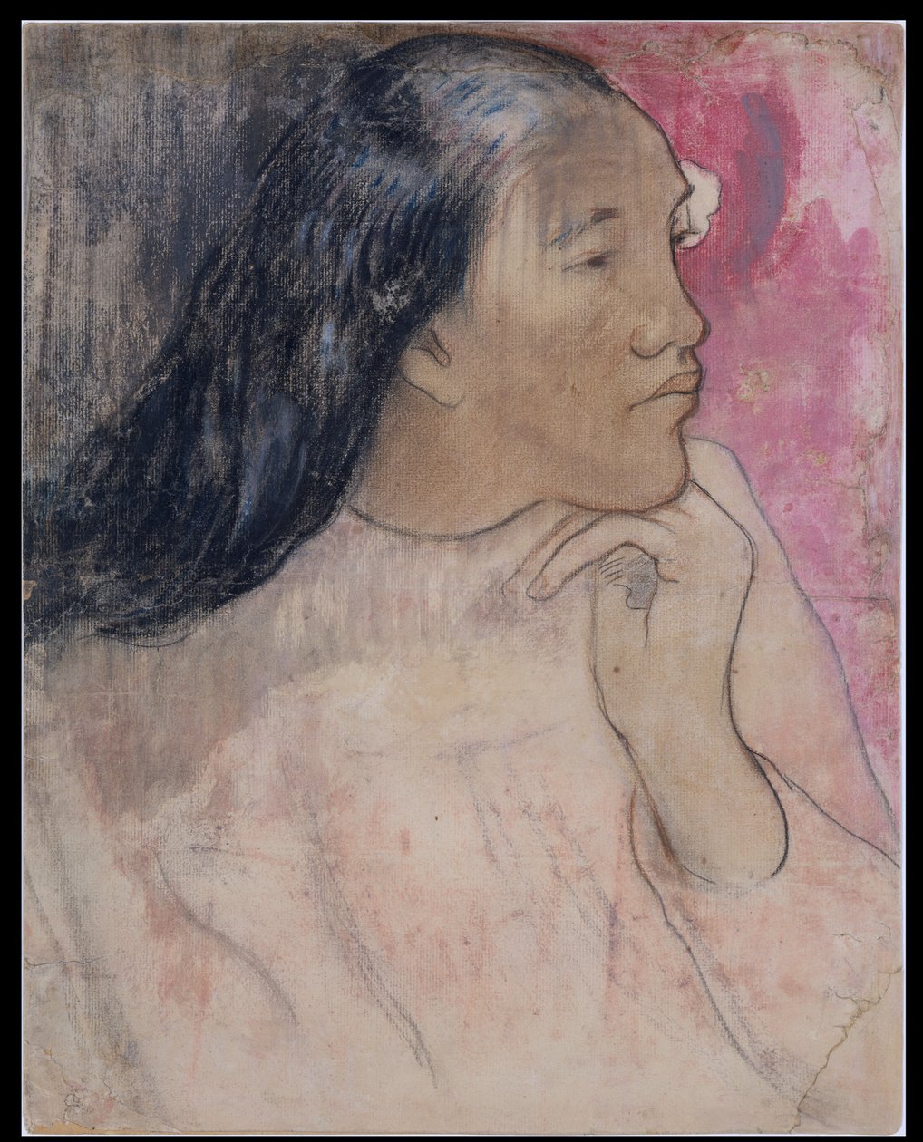 En tahitisk kvinne med en blomst i håret av Paul Gauguin