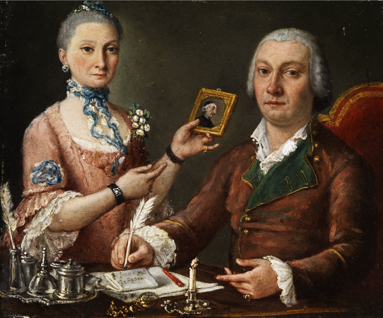 Par ved et bord med blekkbrønn og stearinlys av Pietro Fabris