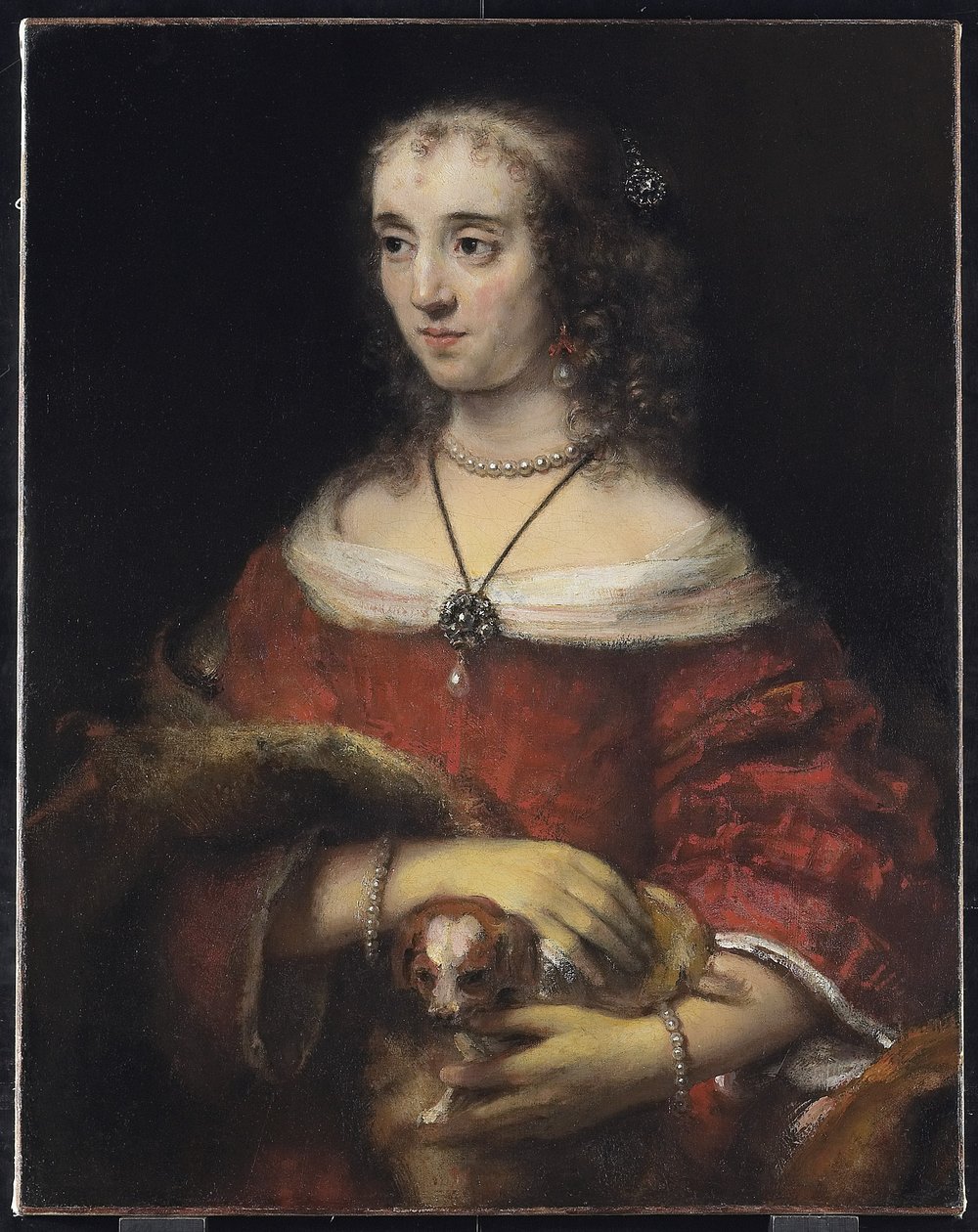 Portrett av en dame med en lapphund, ca. 1665 av Rembrandt van Rijn