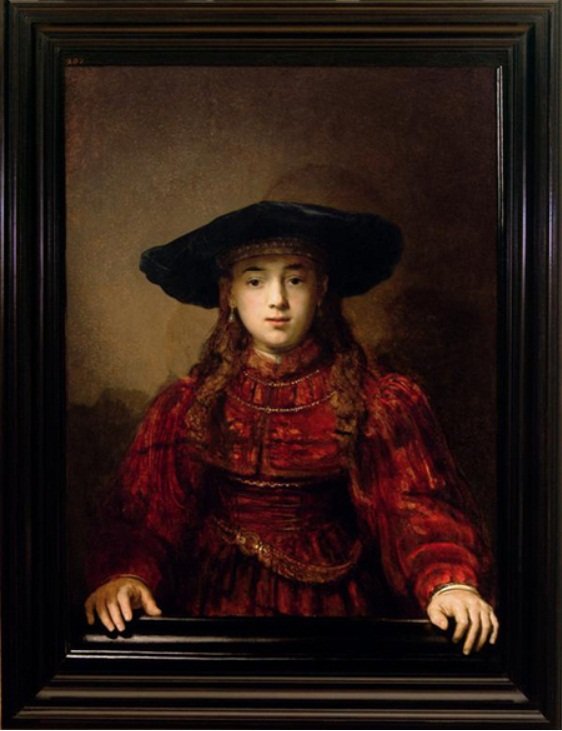 Jente i bilderamme av Rembrandt van Rijn