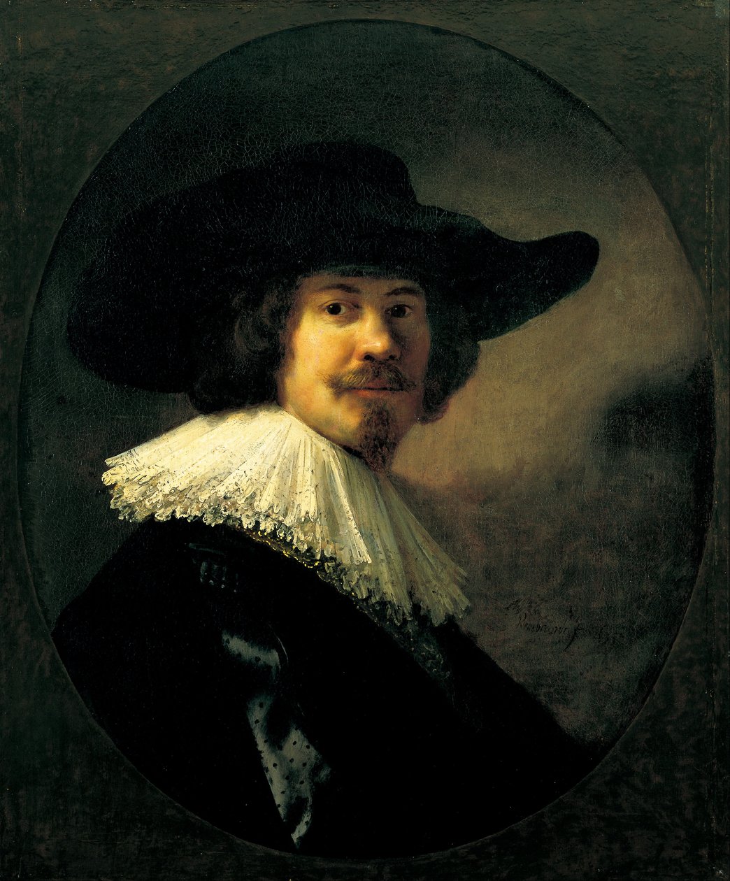 Portrett av en mann i en bredbrettet hatt av Rembrandt van Rijn