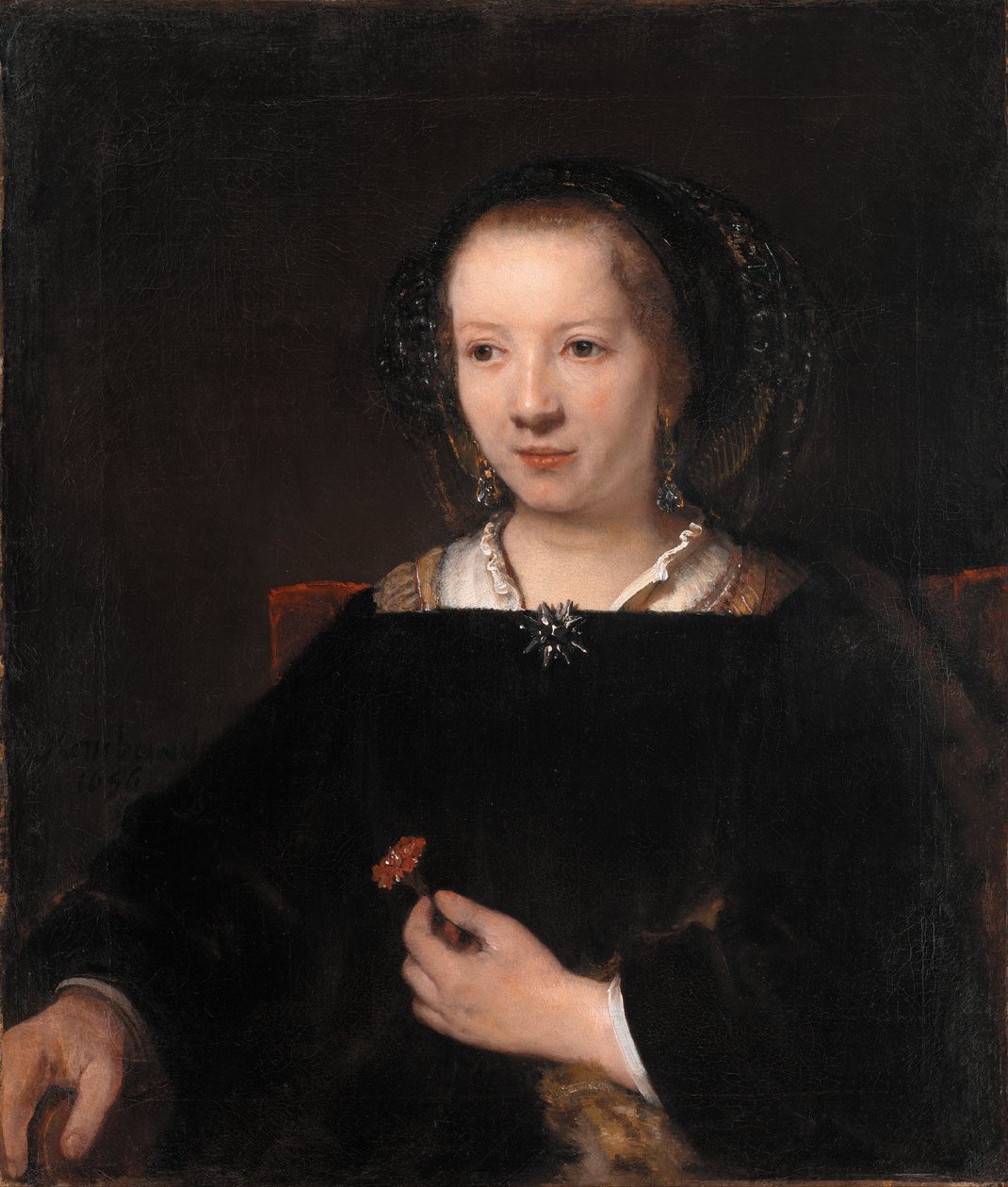 Ung kvinne med en nellike av Rembrandt van Rijn