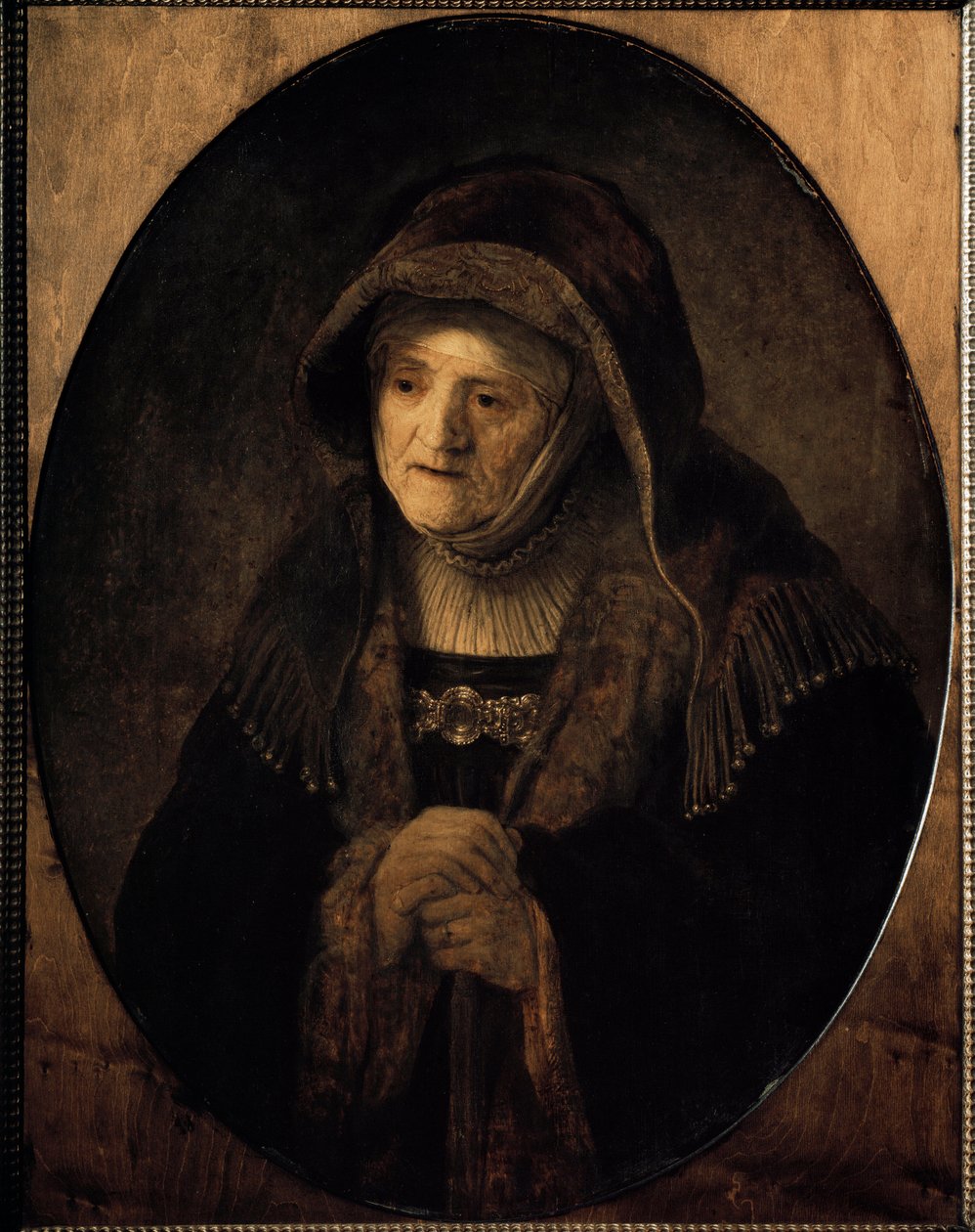 Portrett av kunstnerens mor støttet på stokken hennes (olje på lerret av Rembrandt van Rijn