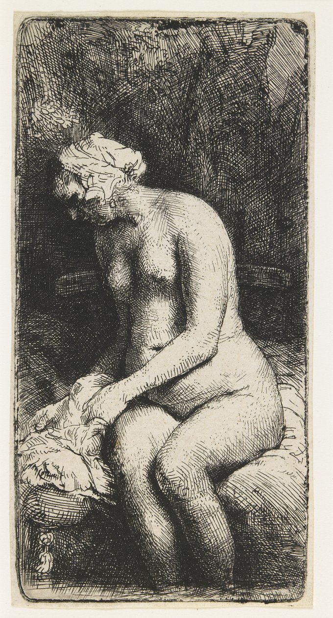 Kvinne som bader føttene ved en bekk av Rembrandt van Rijn