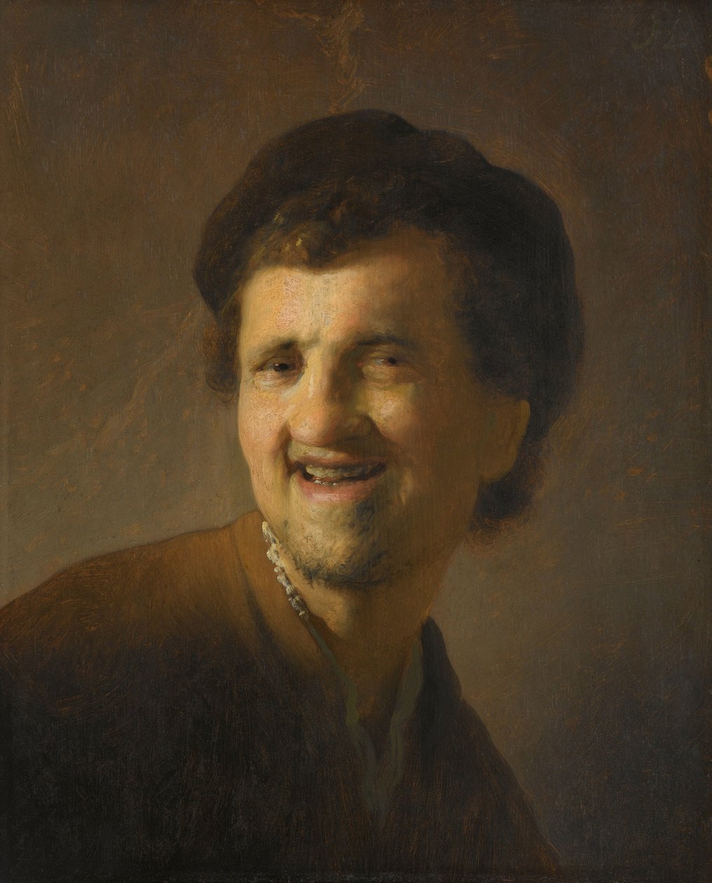 Leende ung mann Byste av en leende ung mann av Rembrandt van Rijn (circle of)
