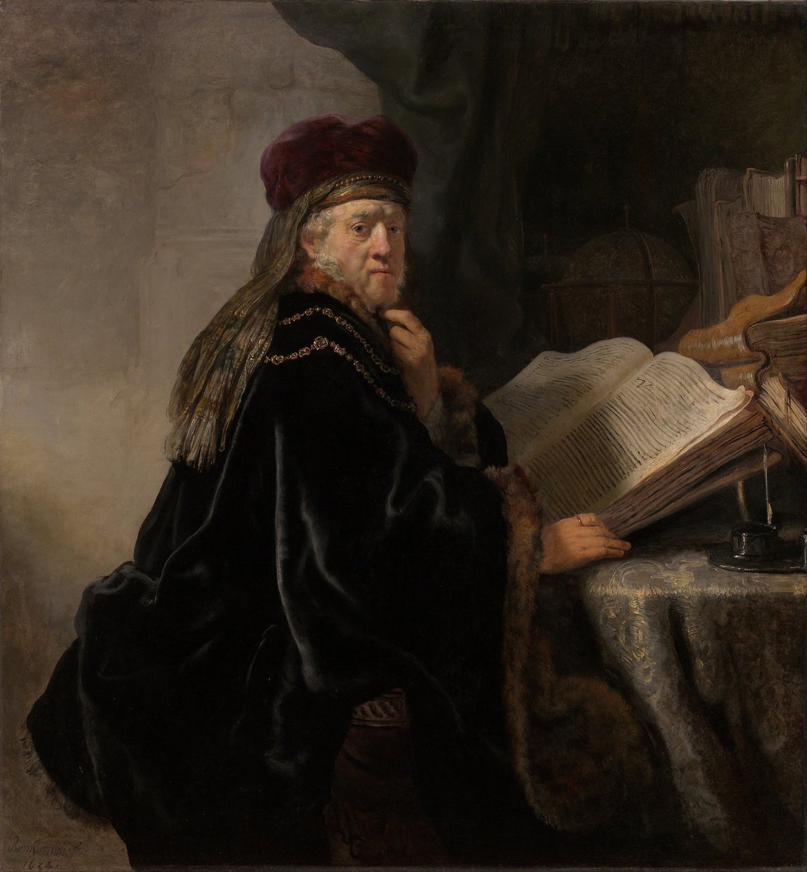 En lærd som sitter ved en pultstipendiat ved studiet av Rembrandt van Rijn