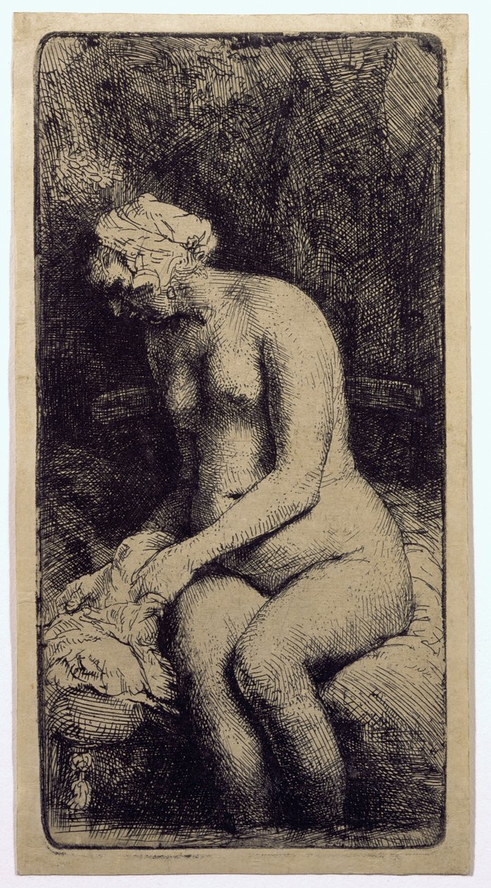 En kvinne som bader føttene ved en bekk av Rembrandt van Rijn