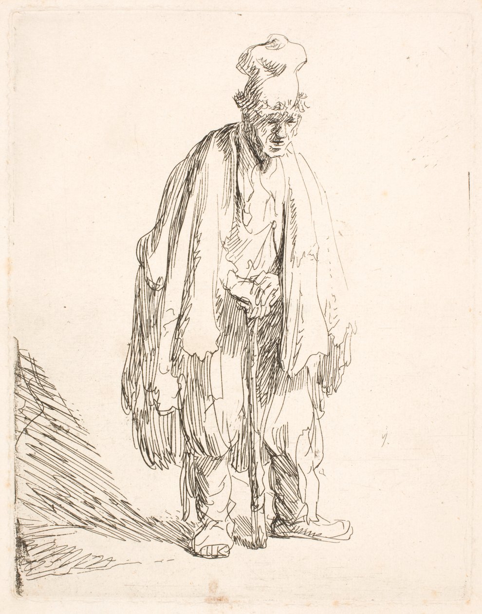 En tigger med høy lue, som står og lener seg på en stokk av Rembrandt van Rijn