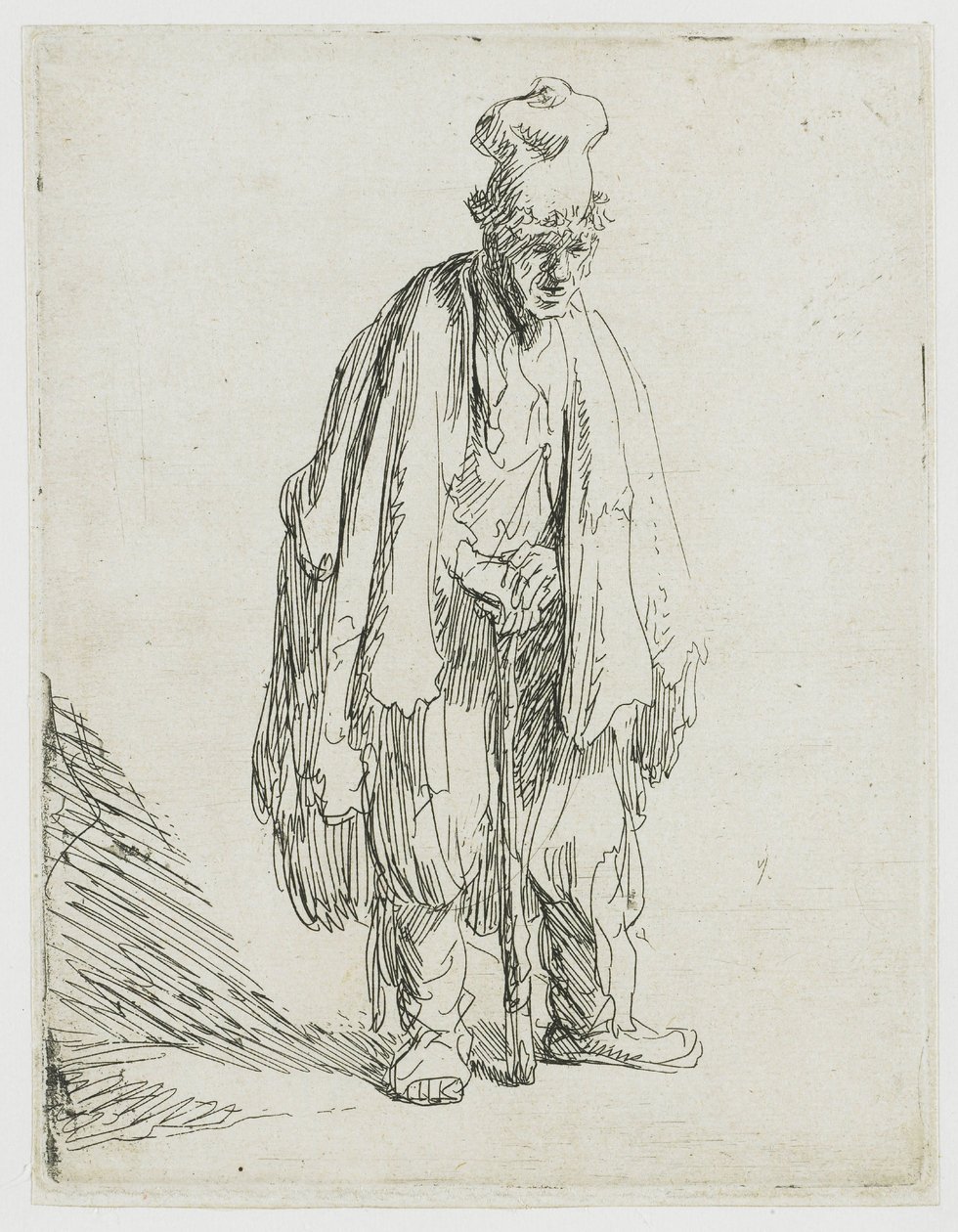 En tigger med høy lue, som står og støtter seg til en stokk av Rembrandt van Rijn