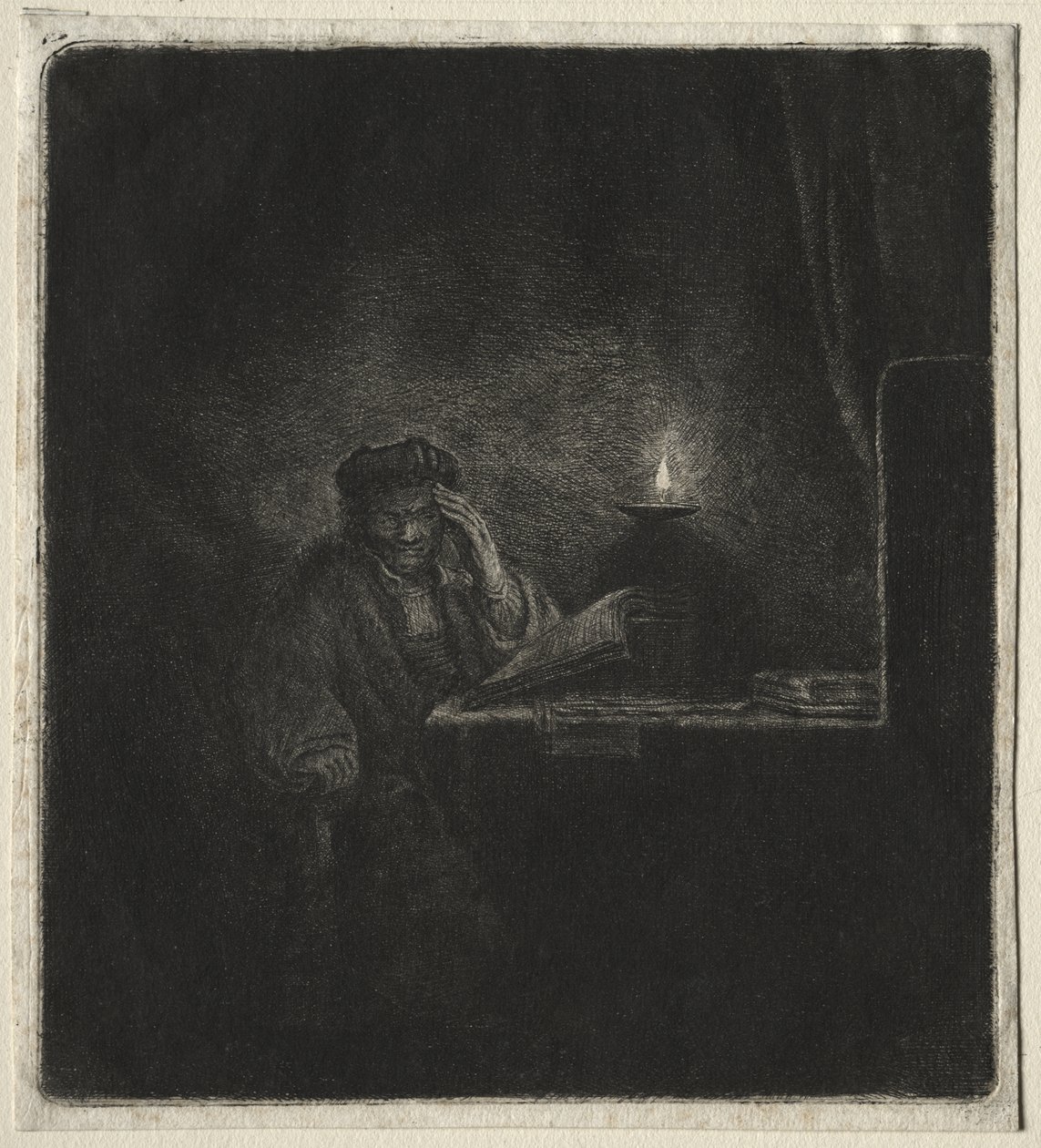 Kopi av Student ved et bord ved levende lys av Rembrandt van Rijn