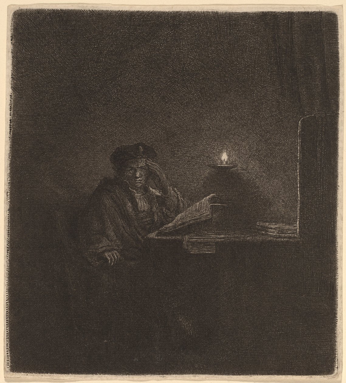 Student ved et bord ved levende lys av Rembrandt van Rijn