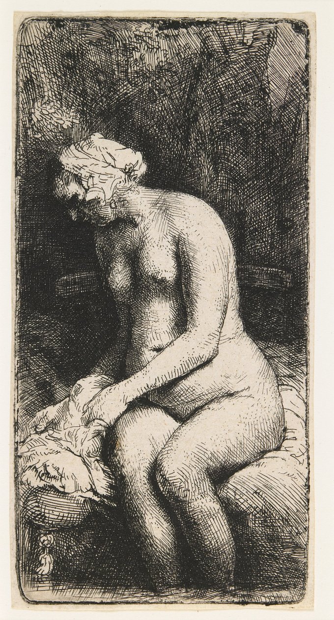 Kvinne som bader føttene ved en bekk av Rembrandt van Rijn