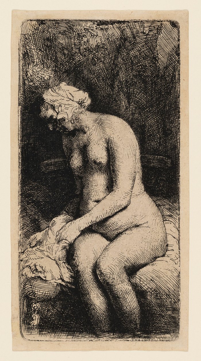 Kvinne som bader føttene ved en bekk av Rembrandt van Rijn