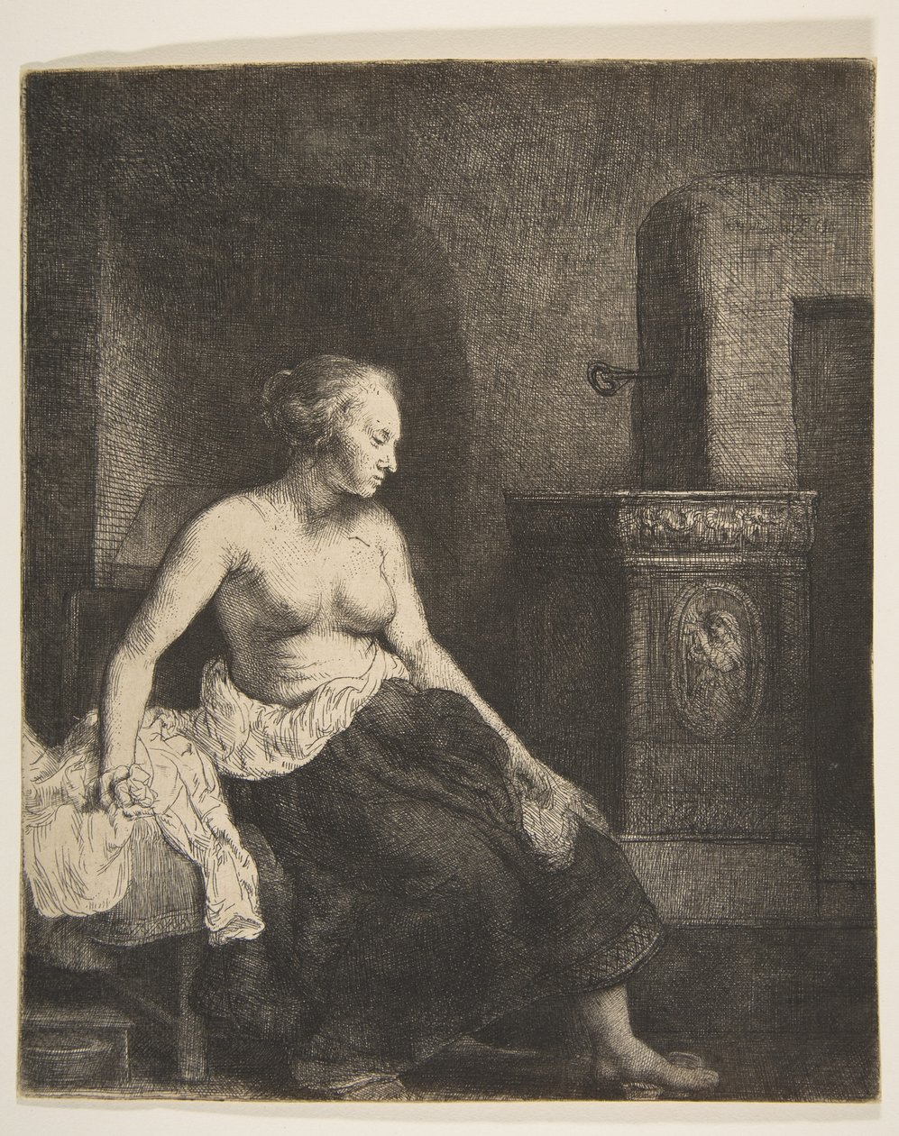 Kvinne som sitter halvkledd ved siden av en komfyr, 1658. av Rembrandt van Rijn