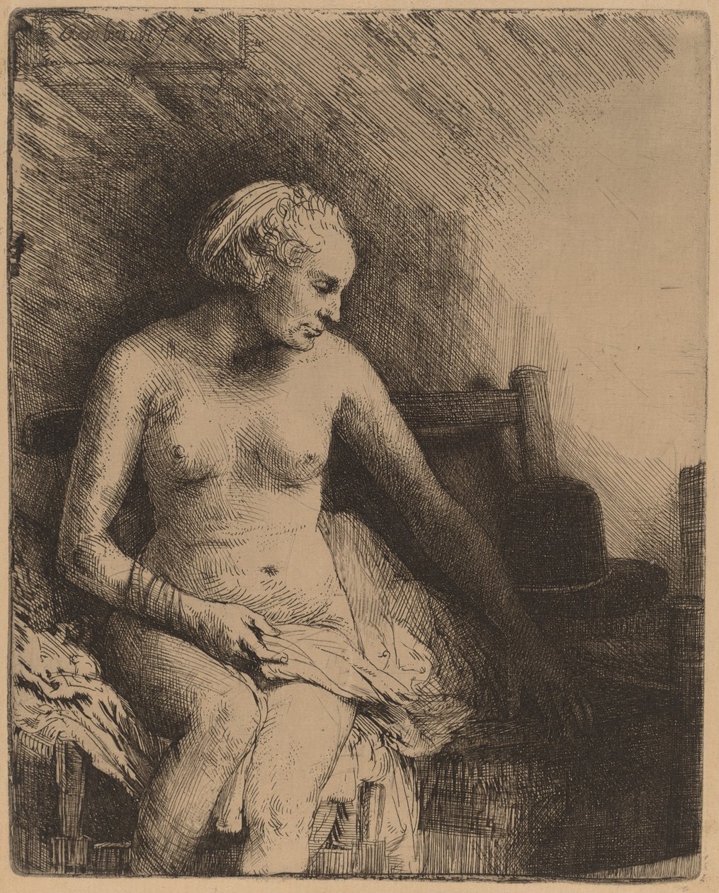 Kvinne på badet med en hatt ved siden av henne av Rembrandt van Rijn