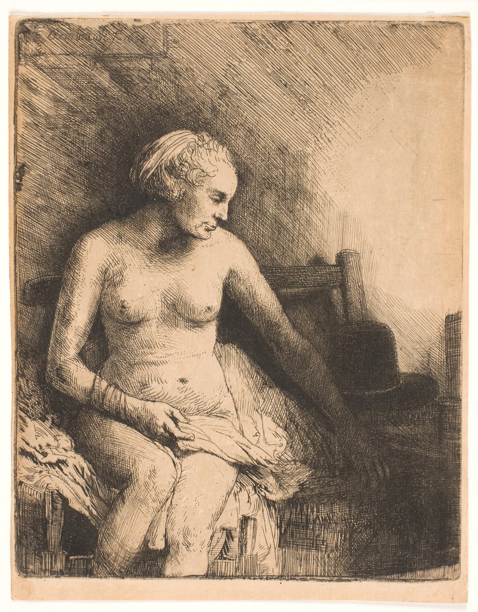 Kvinne på badet, med en lue ved siden av seg av Rembrandt van Rijn