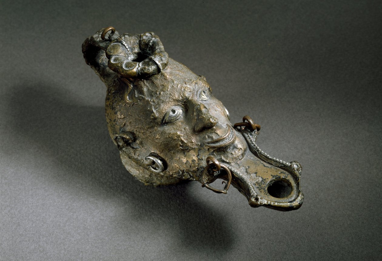 Romersk kunst: bronseoljelampe i form av et ansikt. 1. eller 2. århundre e.Kr. Spanias museum for Ampurias (Empurias) av Roman