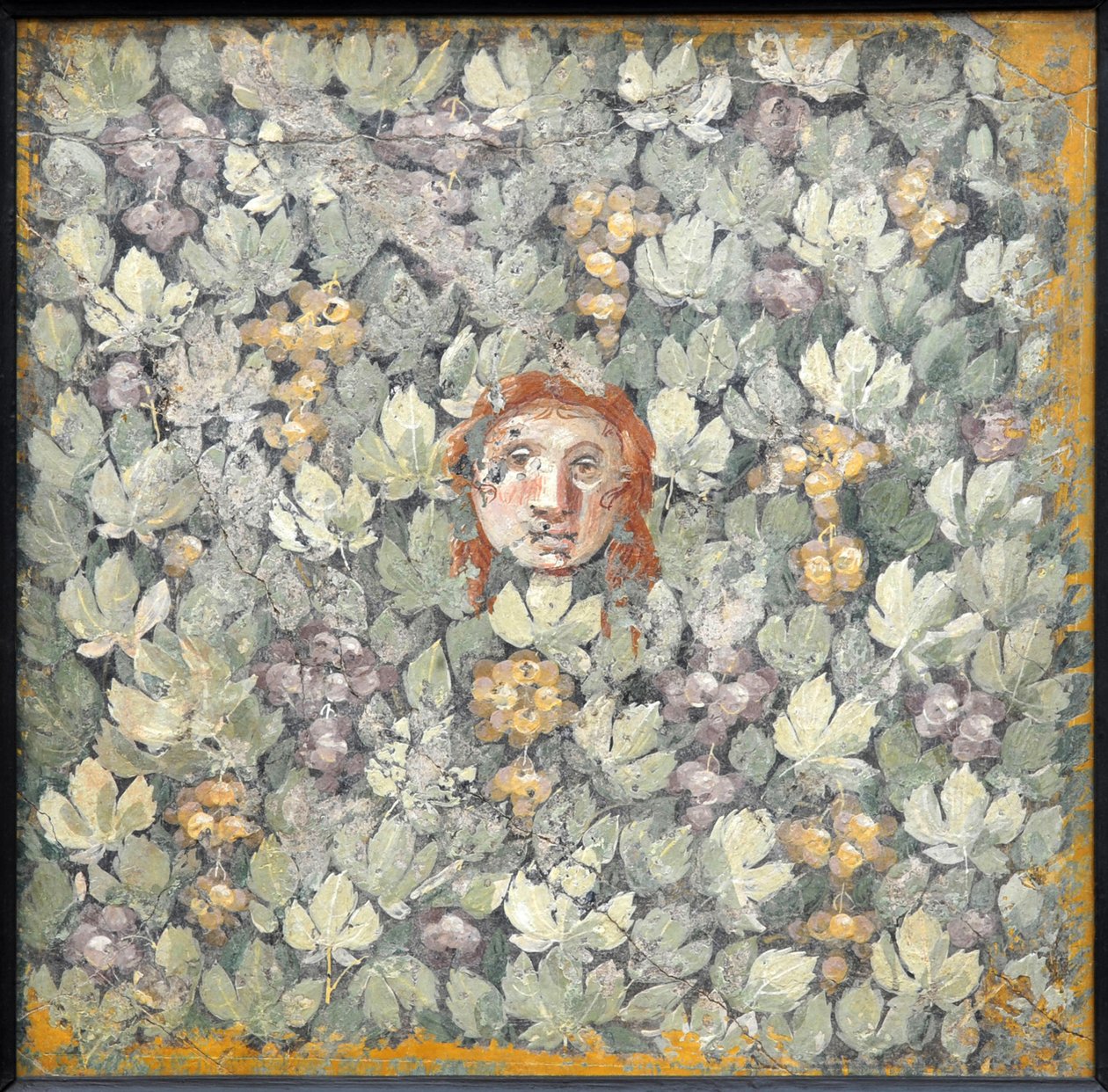 Maske på vinblader og drueklaser, 1. H. 1. århundre. AD. av Roman Pompeian wall painting.