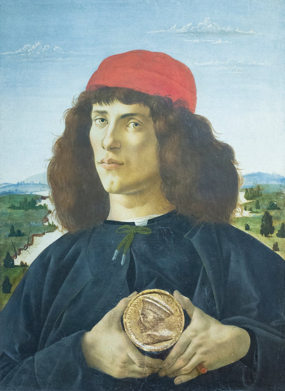 Portrett av en ung mann som holder en medaljong av Cosimo de