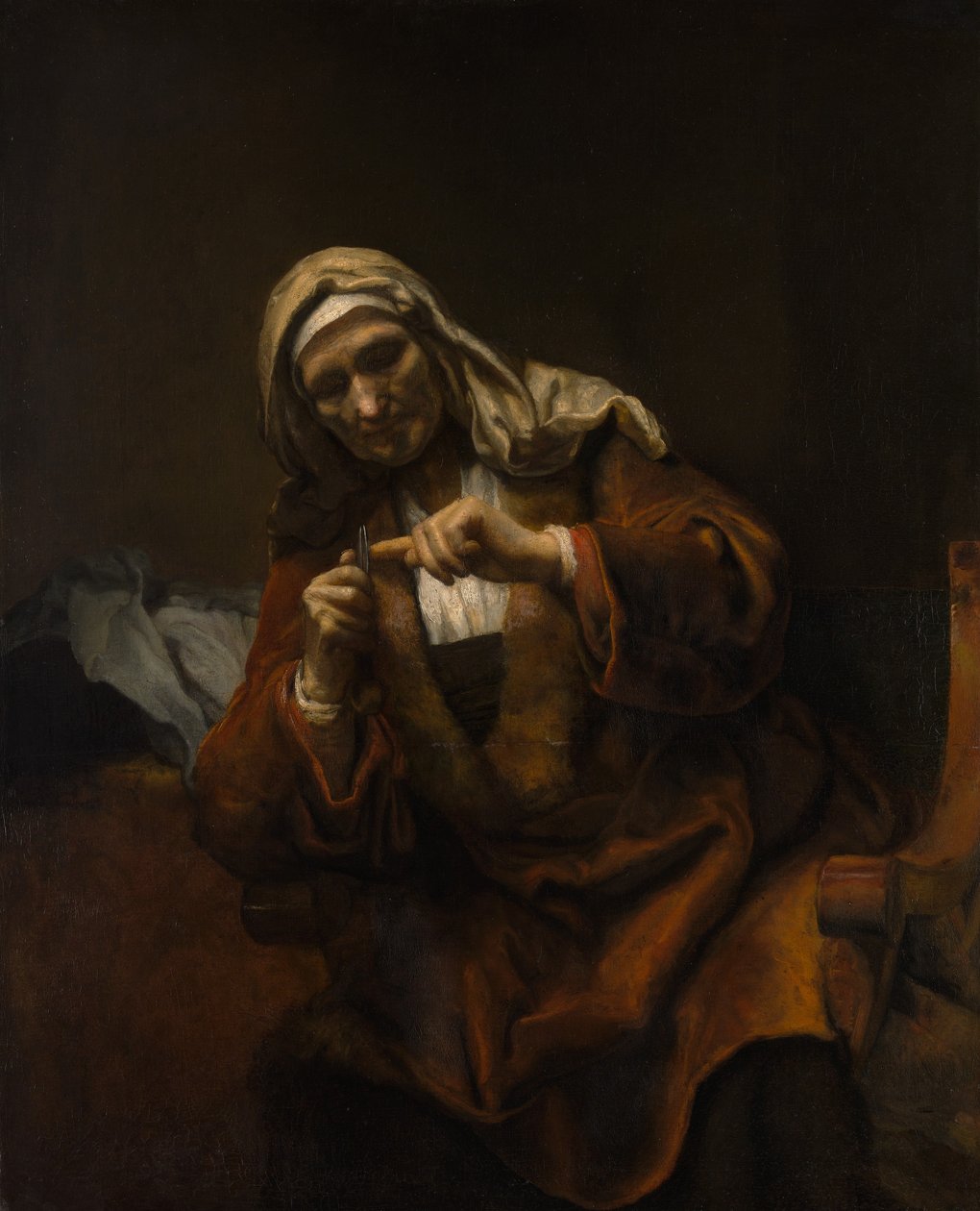 Gammel kvinne som klipper neglene, ca. 1655-60. av Style of Rembrandt