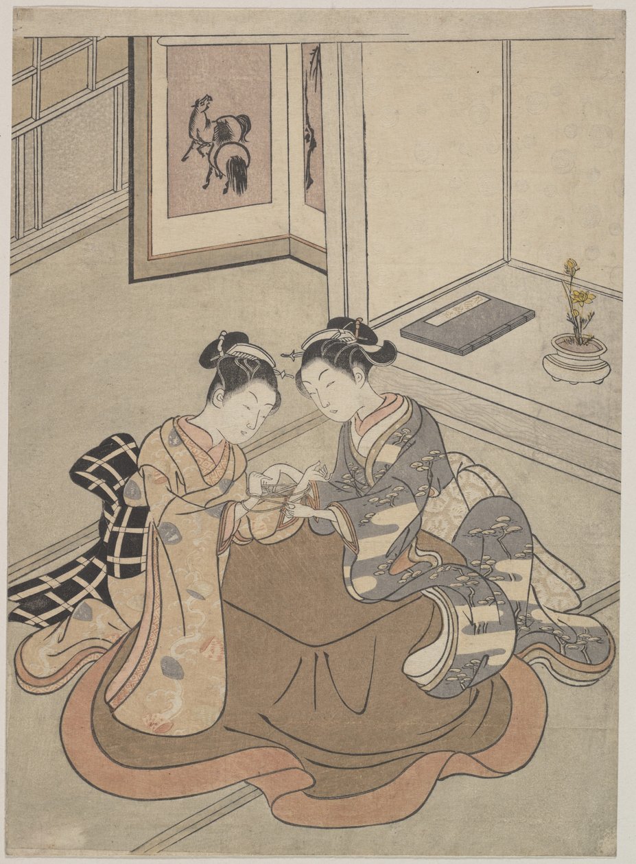 To unge kvinner sitter ved en Kotatsu lekende katteholder av Suzuki Harunobu