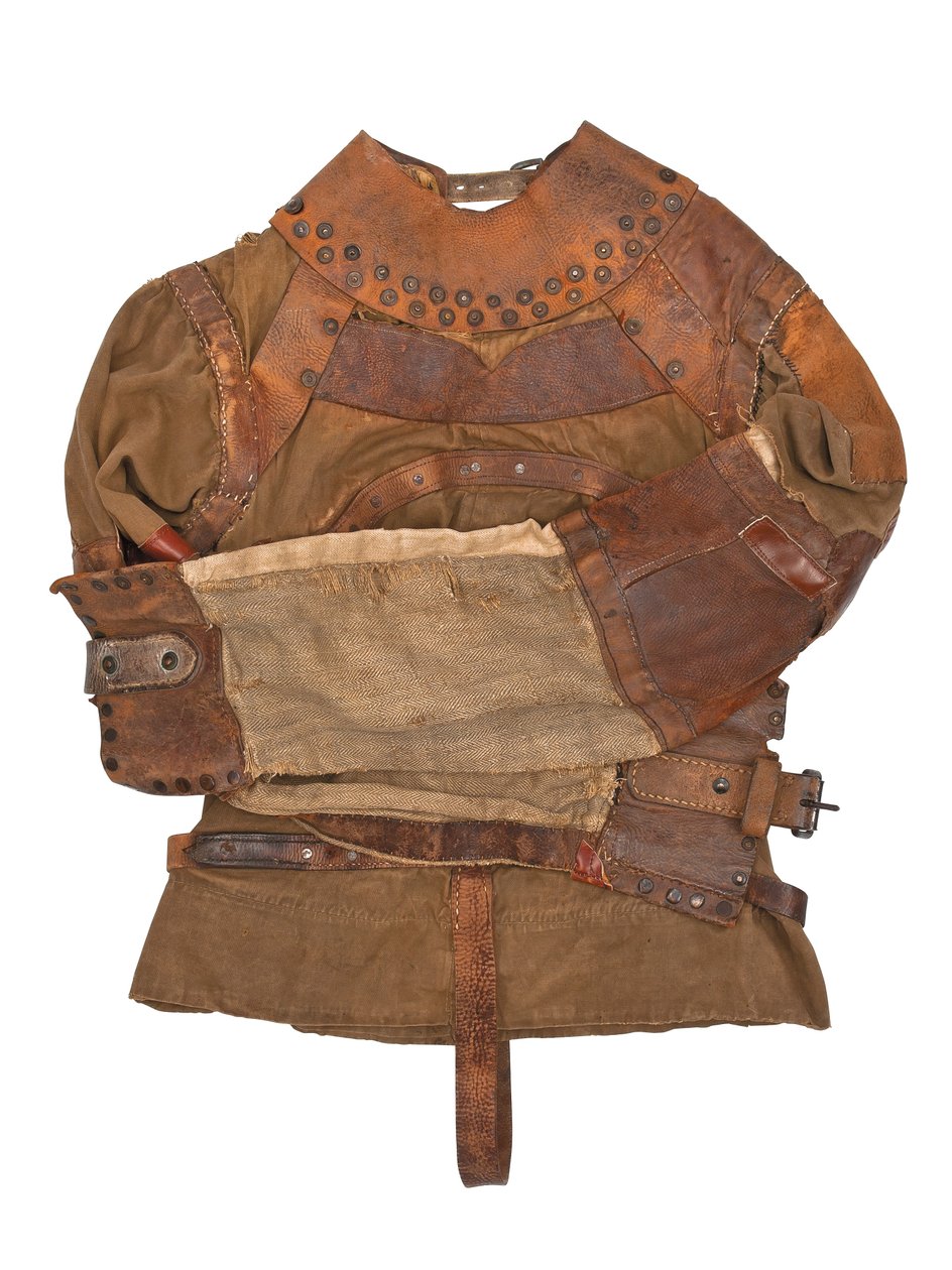 Tvangstrøye eid av Harry Houdini, ca. 1915 (khaki lerret, lær og metallnagler) av Swanfeldt Tent and Awning Co.