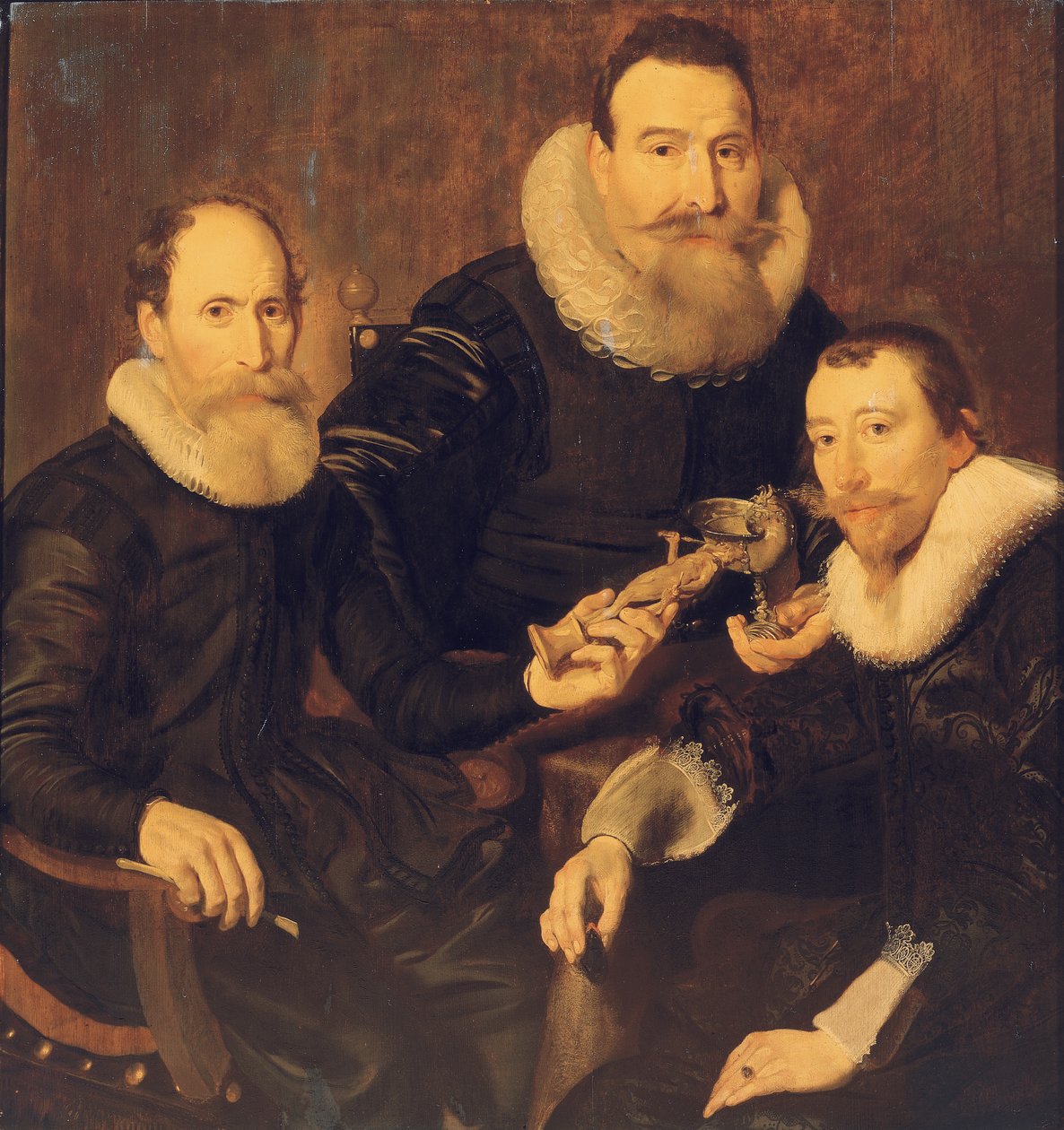 Gruppeportrett av tre herrer, trekvart lang, sittende i svarte kostymer med blondekrager, 1635 av Thomas de Keyser