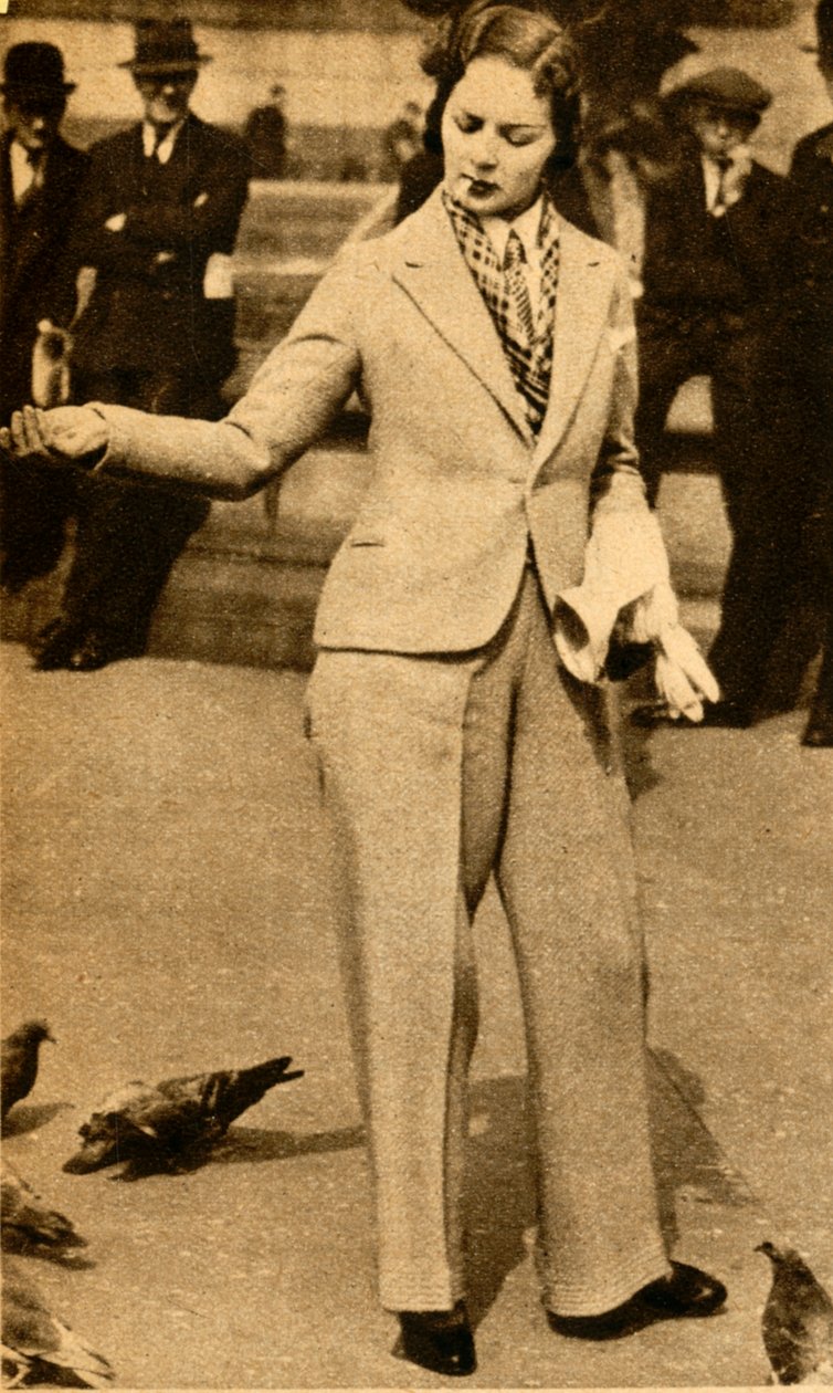En bedrøvet dame som mater duer på Trafalgar Square, 1933. av Unbekannt