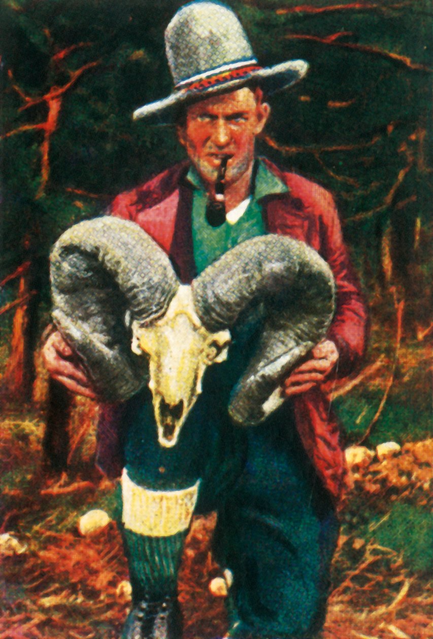 Troféjeger som holder Bighorn sauehodeskalle, c1928. av Unbekannt