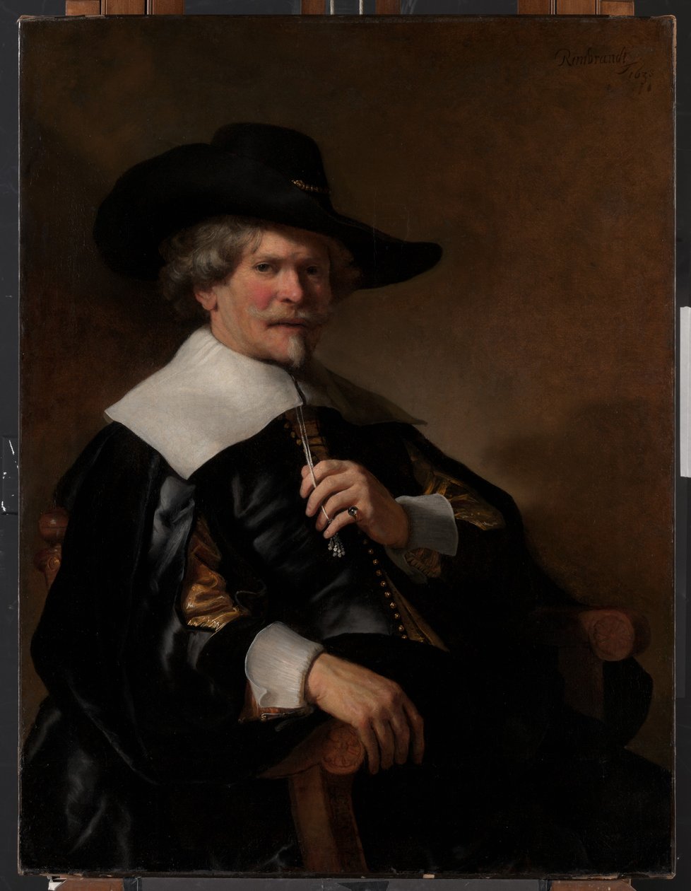 Portrett av en mann som sitter i en lenestol av Unknown