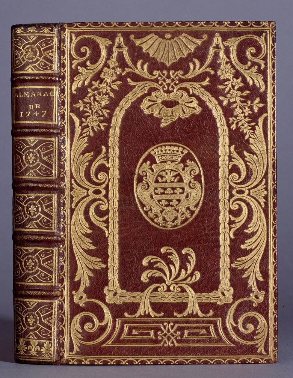 Bokomslag, innbinding med ornamenter varierer til armene til cotte-familien til en almanakk fra 1747. Paris, Dekorativ kunst av Unknown artist