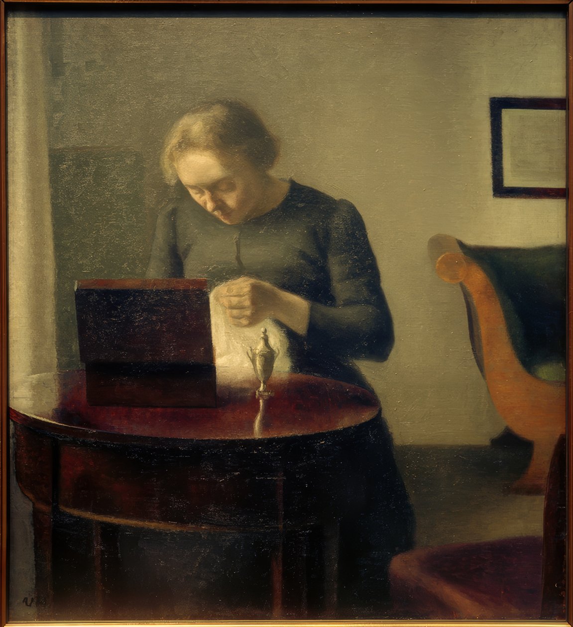 Kunstnerens kone ved sybordet av Vilhelm Hammershoi