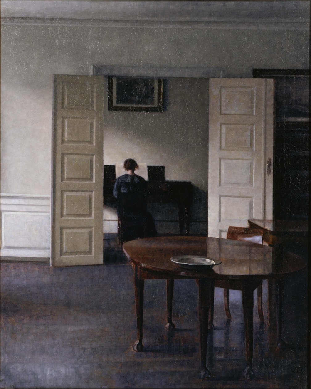 Interiør med Ida som spiller piano av Vilhelm Hammershøi