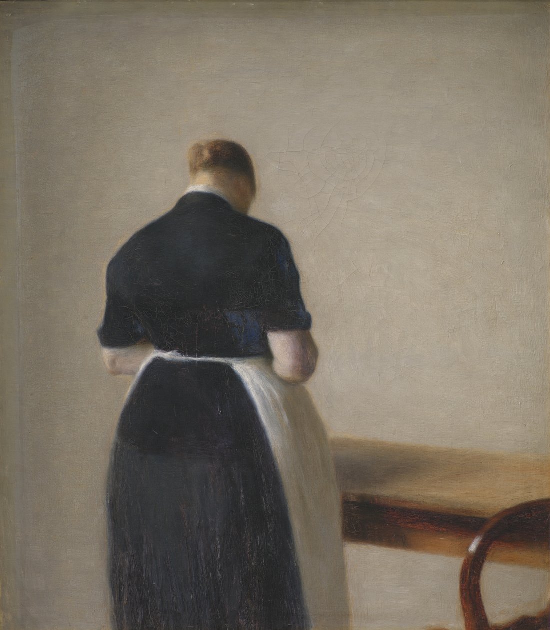 Kvinne sett bakfra av Vilhelm Hammershøi