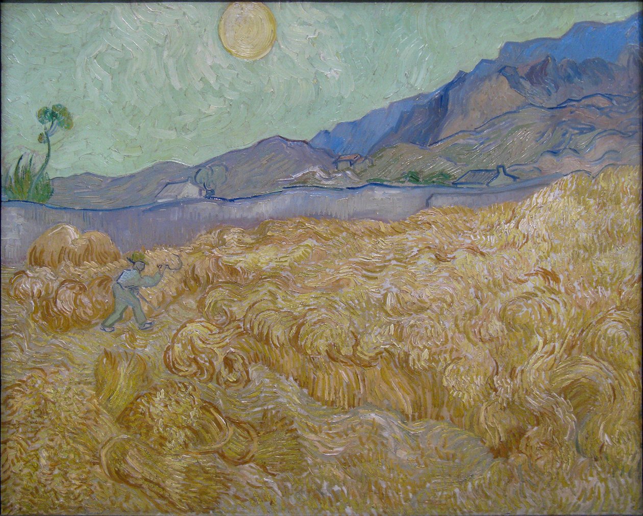 Kornåker med slåmaskin av Vincent van Gogh