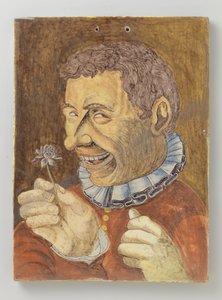 tallerken av fajanse med mann med blomst av Anonymous