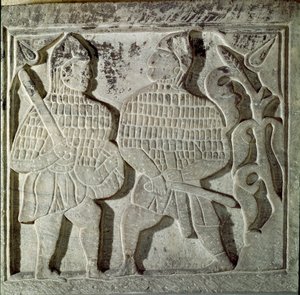Seljukide Art (Seljukide eller Saljuqide): lavt relieff som representerer to krigere. Fra Konya, Tyrkia. 1200-tallet. Tyrkisk islamsk kunstmuseum, Istanbul