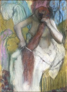 Kvinne som kjemmer håret av Edgar Degas