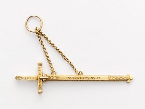 Miniatyr minnesverd (tre og gull) av English School