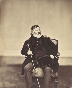 [Sittende mann med stokk og hatt], 1850-60-tallet.