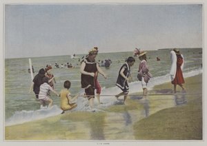 Barn som leker med et tau på stranden (fargebilde) av French Photographer