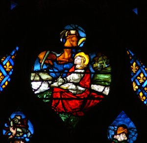 Det vestlige rosevinduet som viser en scene fra Åpenbaringsboken: Åpning av det tredje seglet, med St. Lukas-oksen (6:5) av French School