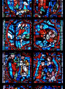 Vindu som viser scener fra Kristi barndom, inkludert magi som ble advart i søvne, og magi med jomfru og barn av French School