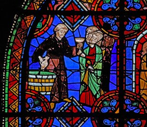 Vindu w06 som viser pilegrimer ved graven til St. Julian av Brioude hvor vin deles ut av French School