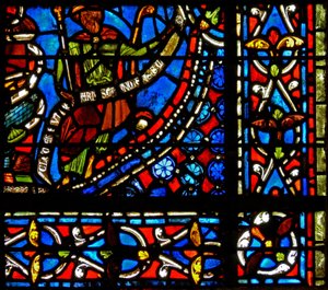 Vindu w9 som viser farao som holder en banderole med ordene I Clement of Chartres laget dette vinduet (i Joseph-vinduet) av French School